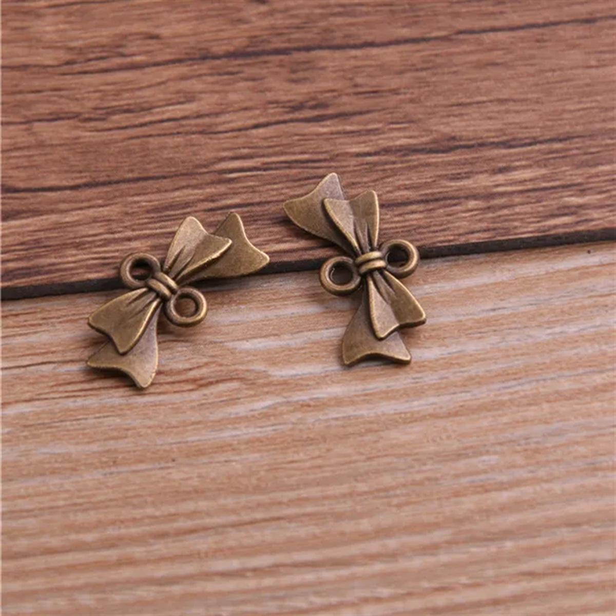 

Подвеска-шарм в виде бантика из сплава для мобильных телефонов, сделай сам, 2 цвета, 10x20мм античный бронзовый