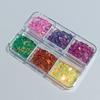 Six-Compartment Sequin Nail Art Kit: Stars, Moon, Hearts, Flowers, and Diamonds.
