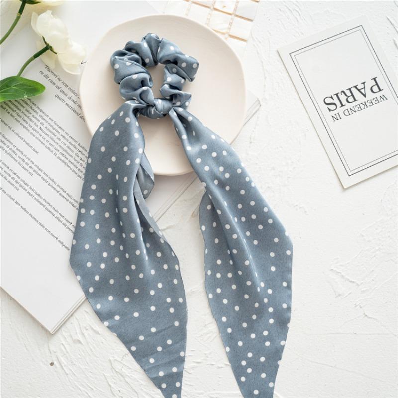 Long flowing ribbon large braided hair accessory for women - ponytail bun hair band with floral design, simple and elegant.