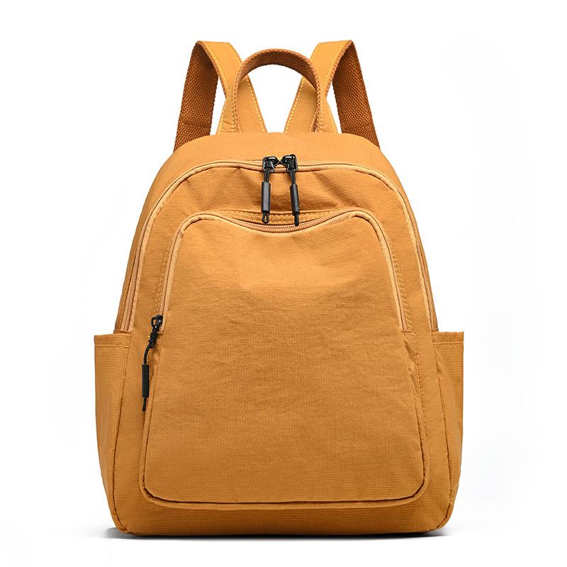 Schoolbag1011 New Simple Casual Backpack Women's Versatile Commuter Large Capacity Backpack Go Out and Play Lightweight Mountaineering Bag
