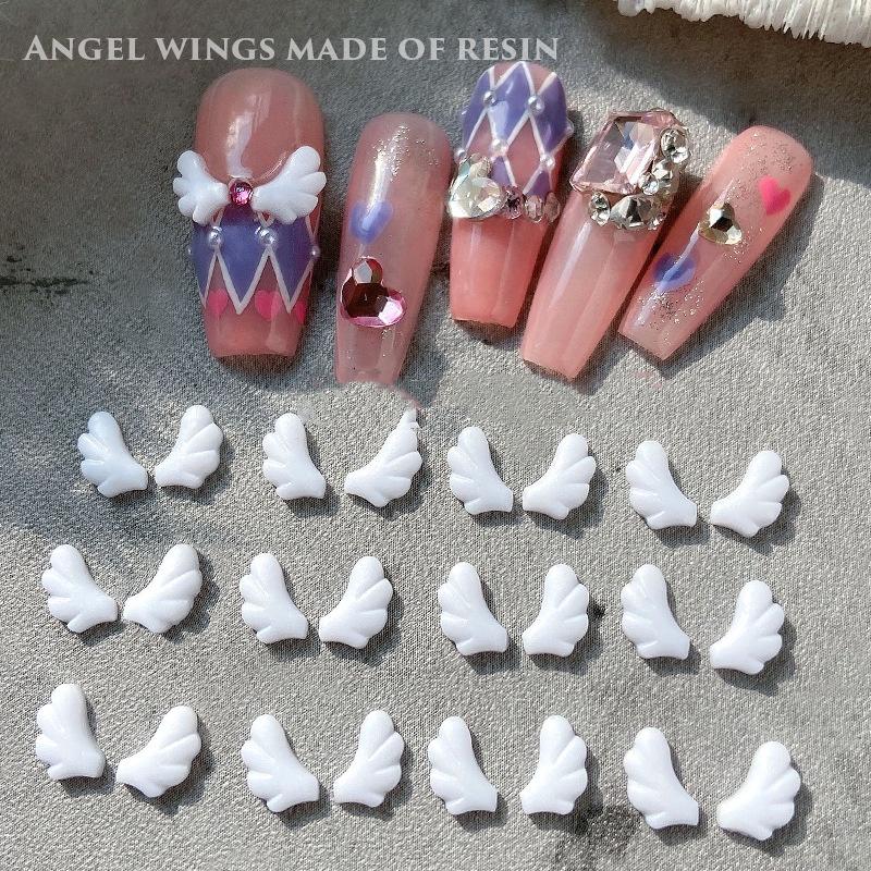 50 Stück links/rechts gespleißte Engelsflügel Nail Art Charms linke und rechte Flügel weißes Harz Nail Art Dekorationswerkzeuge
