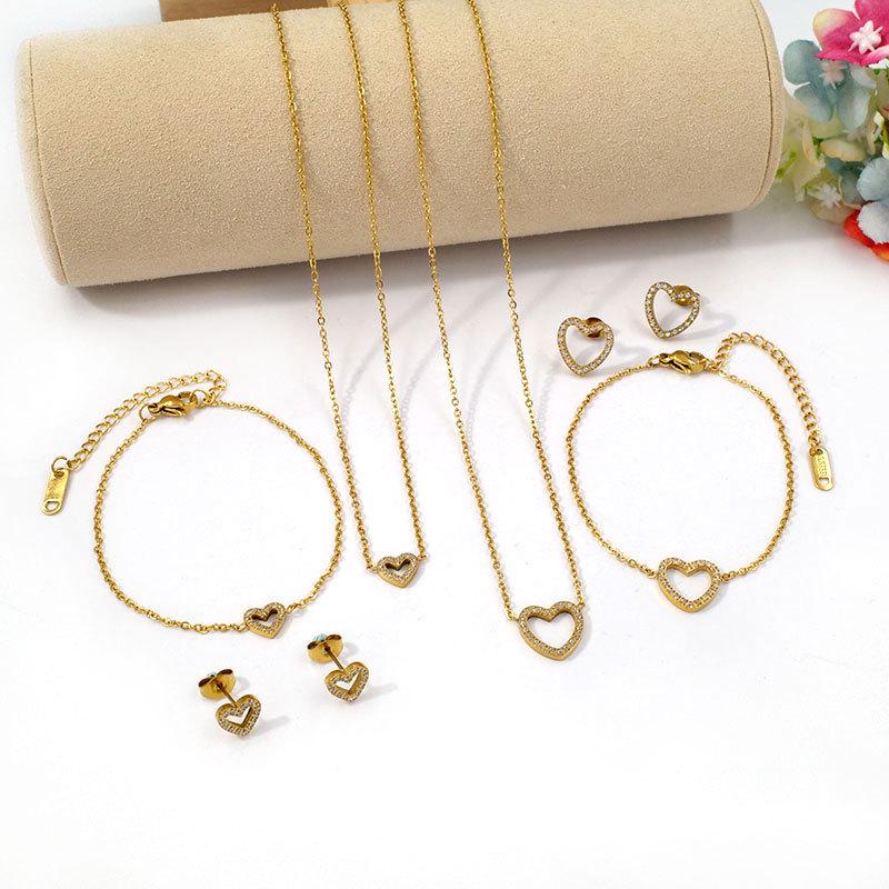 European Diamond-Accented Heart Jewelry Set: Necklace, Bracelet & Earrings in Titanium Steel for Women's Luxurious Style.
