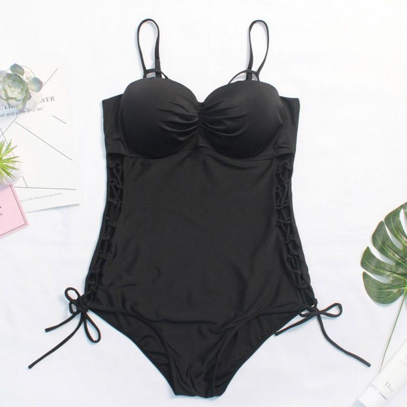 

Однотонний чорний купальний костюм. Жіночий цільний купальник монокіні. Купальний костюм великих розмірів. Купальник зі шнурівкою 4XL чорний