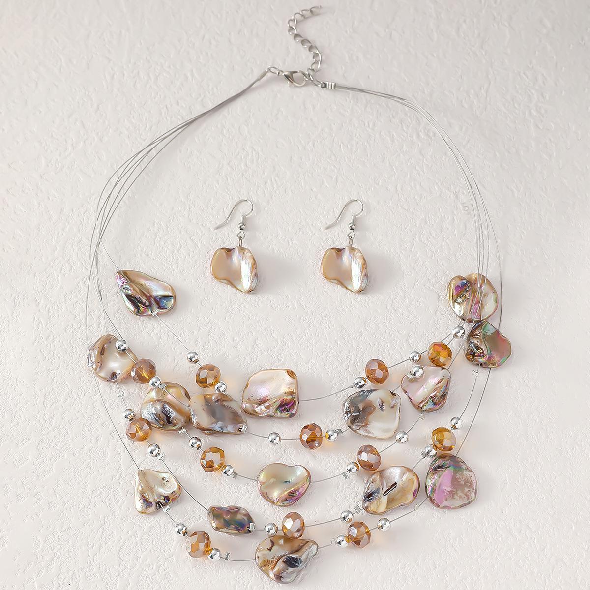 

Европейский и американский гравийный нерегулярный комплект из ожерелья и серег