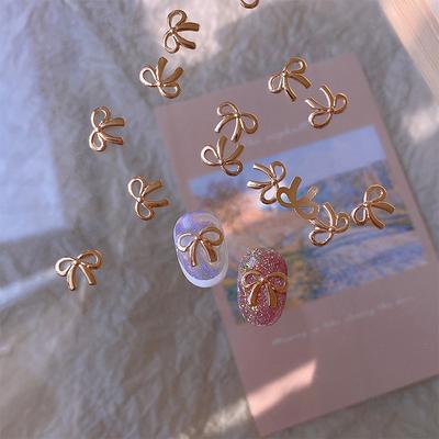 5Pcs/Bag Elegant Alloy Bow Nail Charm 3D Metal Silver Gold Champagne Gold Light Luxury Hollow Bow Super Fairy Nail Art Accessory