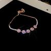 Pink Diamond Zirconia Starburst Flower Bracelet: Trendy, Luxurious Jewelry with Unique Design.