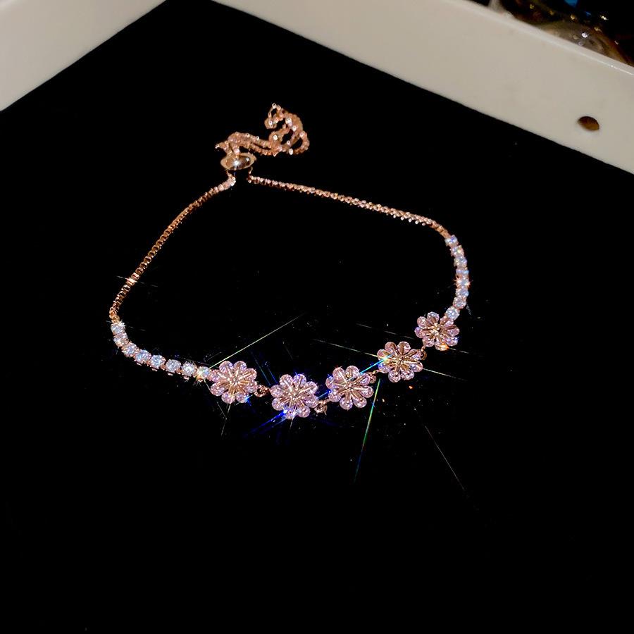 Pink Diamond Zirconia Starburst Flower Bracelet: Trendy, Luxurious Jewelry with Unique Design.