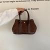 Suede hand carry garden bag retro shoulder messenger bag autumn and winter new portable small tote bag