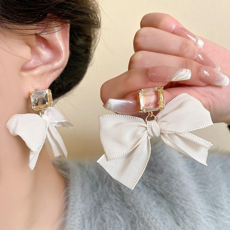 European and American retro white bow earrings women's light luxury temperament super flash zircon stud earrings exaggerated personality earrings