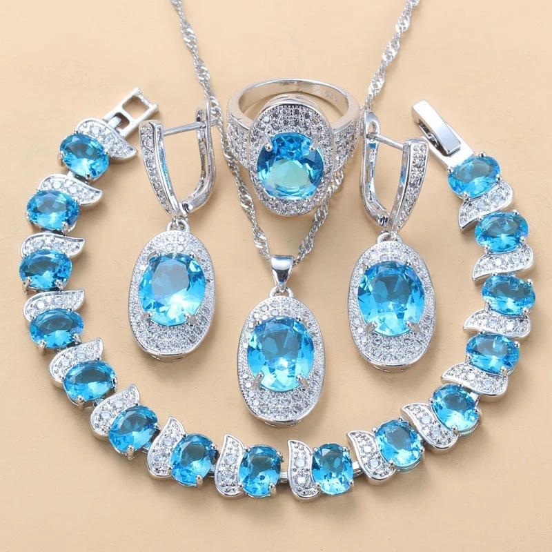 Čtyřdílná sada vykládaná světle modrým zirkonem Dámské náušnice náramek prsten Módní párty svatba