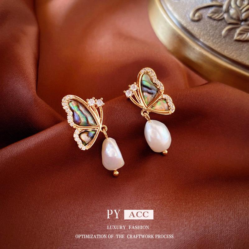 

Винтажные серьги-пусеты из французского серебра 925 пробы с жемчугом высокого класса: Преувеличенная мода с элегантным нишевым дизайном для женщин