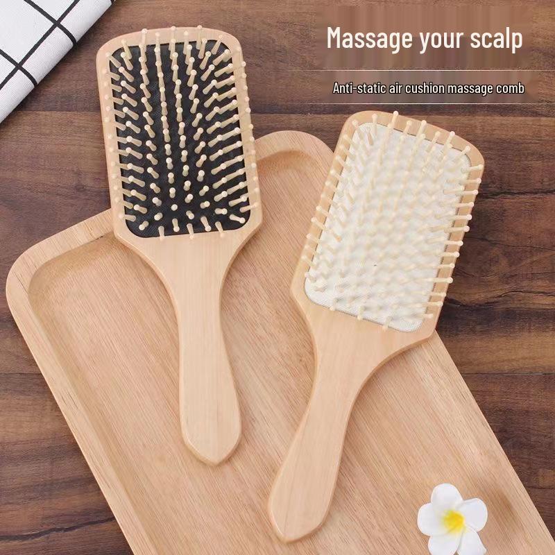 Spazzola a pagaia in legno antistatica per la cura dei capelli lunghi e il massaggio, riduce la caduta dei capelli e doma i ricci con design a cuscino.