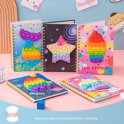 A5-Cartoon-Dekompressionsnotizbuch mit Regenbogen-Metallspule und Silikon-Luftpolsterhülle für Studenten
