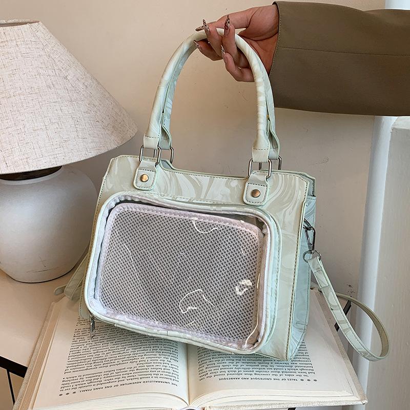 Japanese two-dimensional yuan handbag woman 2025 new girl soft girl shoulder crossbody pain bag portable commuter bag woman