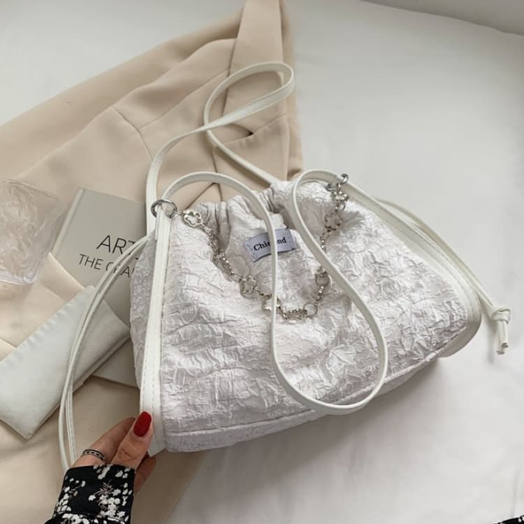 Off-white pleated seersucker drawstring tote bag