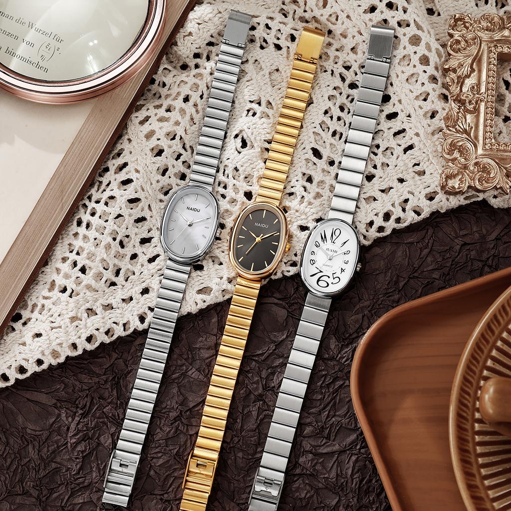 Ladies' exquisite and high-value Arabic numeral scale oval dial bamboo style steel strap quartz watch.