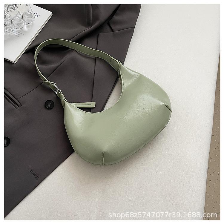 Small bag trend 2025 new fashion handbag high sense versatile women's bag single shoulder solid color half moon armpit bag