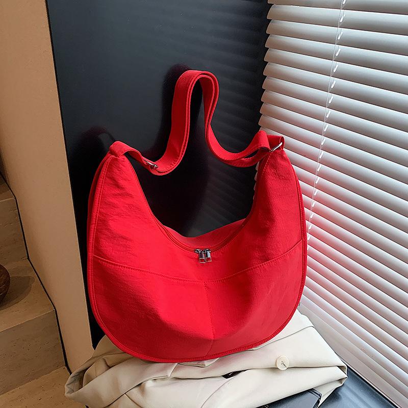 Canvas bag women's large-capacity new niche design sense summer shoulder messenger bag versatile commuter dumpling bag