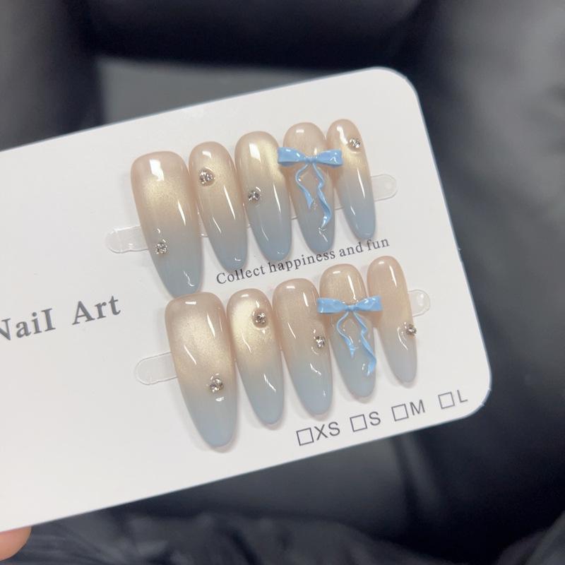 

Blue Gradient Cat Eye Nails with 3D Bow Beads