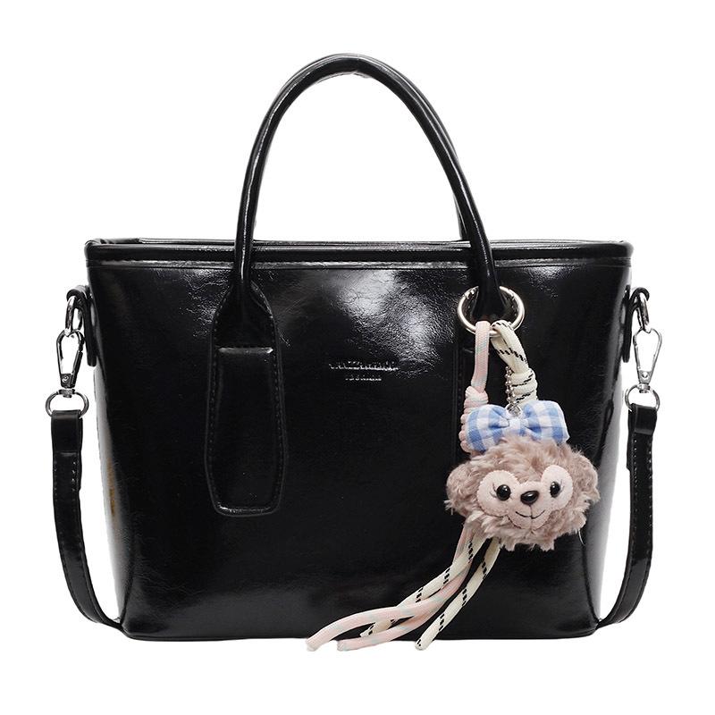 New High-end Korean Version Hugh Simple Portable Bucket Bag Versatile Commuter Fashion Niche Messenger Bag Bag Woman