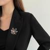 Elegant Rhinestone Bow Brooch with Imitation Abalone Shell for Coats and Sweaters - European and American Fashion Style.