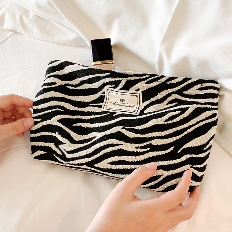 Reise-Kosmetiktasche mit Leopardenmuster und verdicktem Stauraum, praktisches Handdesign für Toilettenartikel