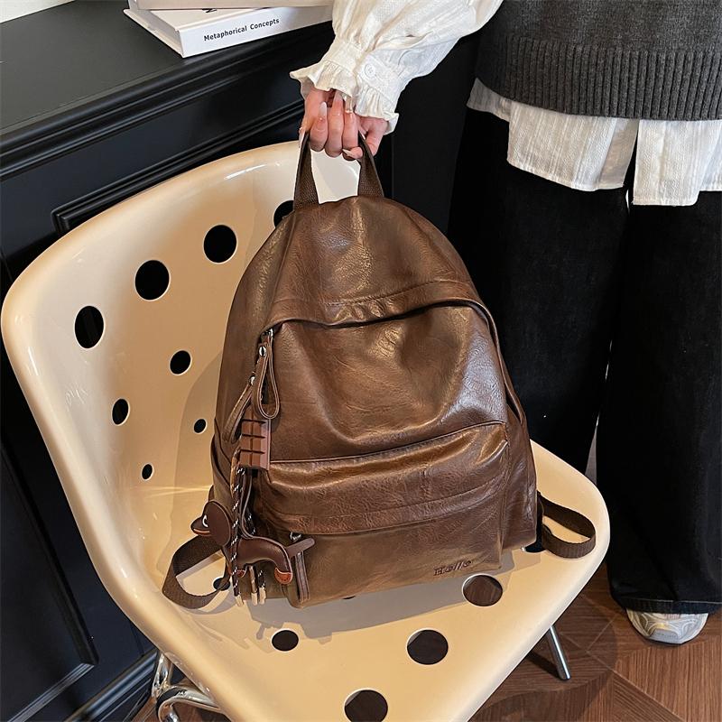 Fashionable PU Leather Backpack with Adjustable Shoulder Straps Simple Design Suitable for Daily Use Travel Shopping and Other Scenarios No Pendant