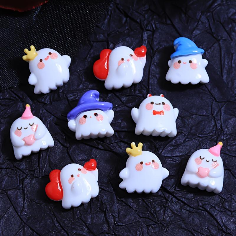 A pack of 12 adorable Halloween ghost resin accessories for DIY hair clips and decorations, including shoe buckles, hat patches,