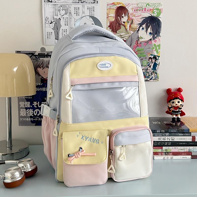The new schoolbag is high-value, fresh and sweet, contrasting colors, splicing, and early high school students' lightweight travel backpack.