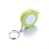 A Stylish Keychain Measuring Tape In Vibrant Colors, Featuring A 1.5-Meter Retractable Design, Perfect for Measuring Clothing Sizes