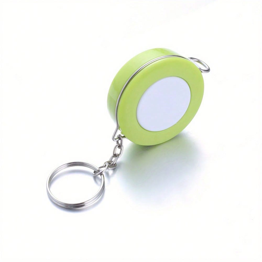 A Stylish Keychain Measuring Tape In Vibrant Colors, Featuring A 1.5-Meter Retractable Design, Perfect for Measuring Clothing Sizes