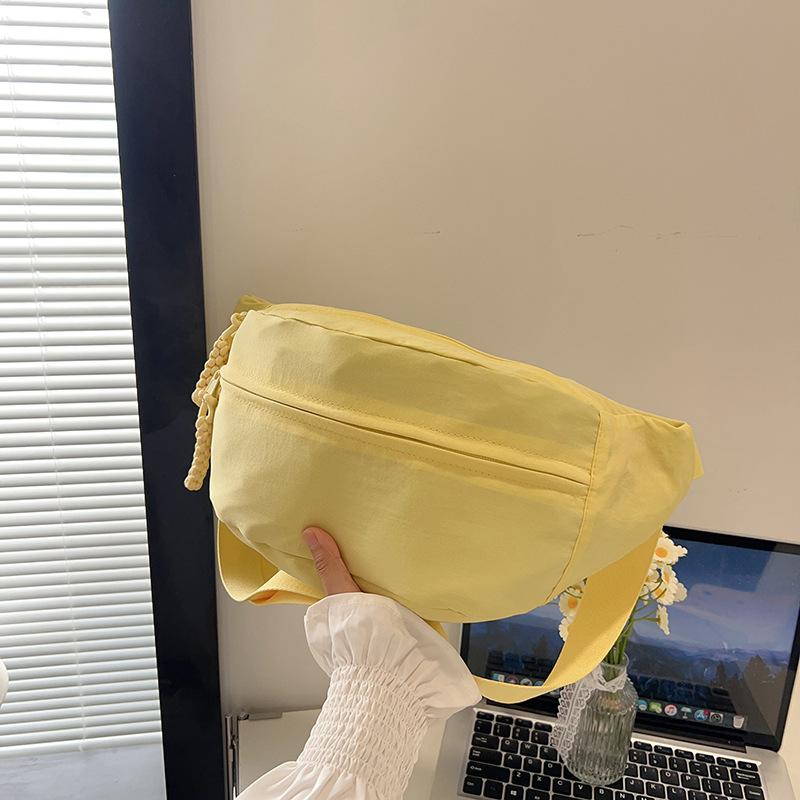 Summer new simple and lightweight men's and women's shoulder messenger bag solid color portable breast bag versatile bag