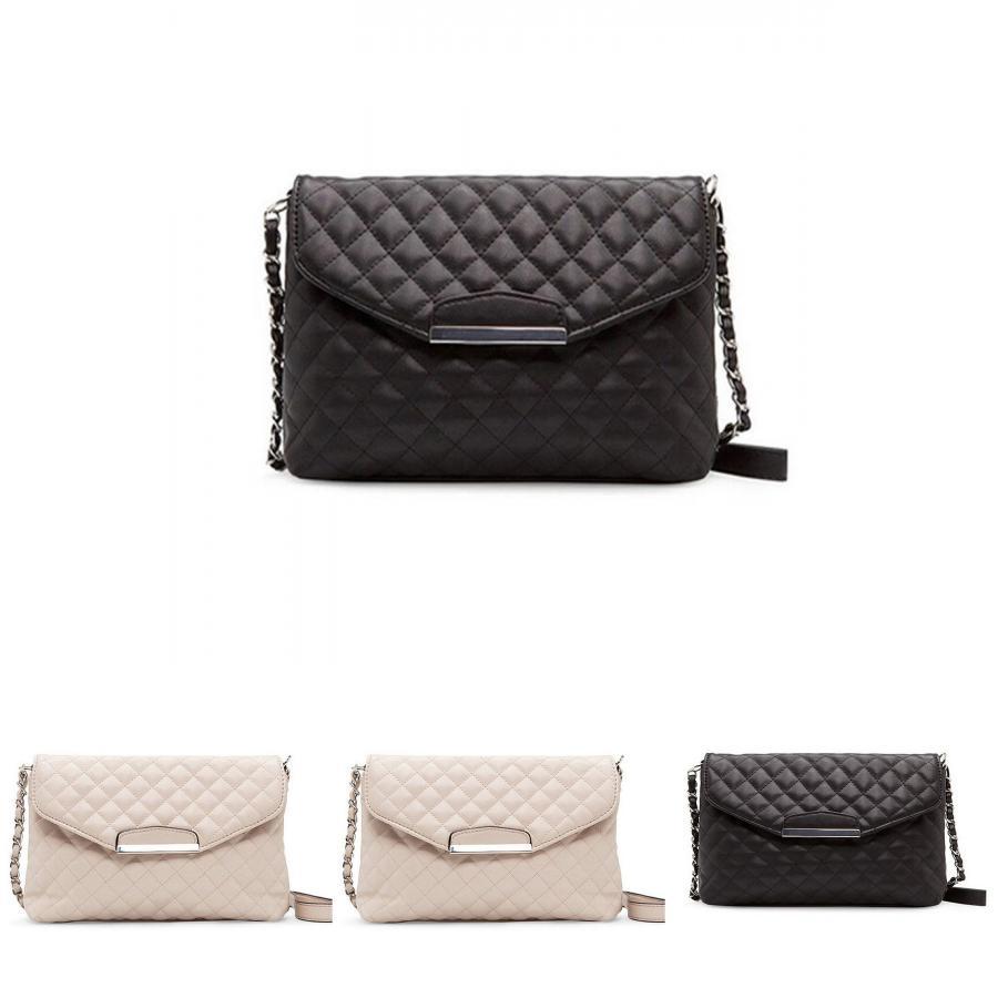 Versatile Women's Leather Clutch Handbag With Classic Appeal And Adjustable Strap