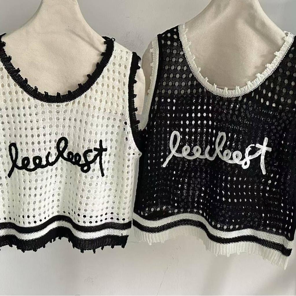 A Versatile Sleeveless Knitted Vest, Waistcoat and Black Top Are Fashionable