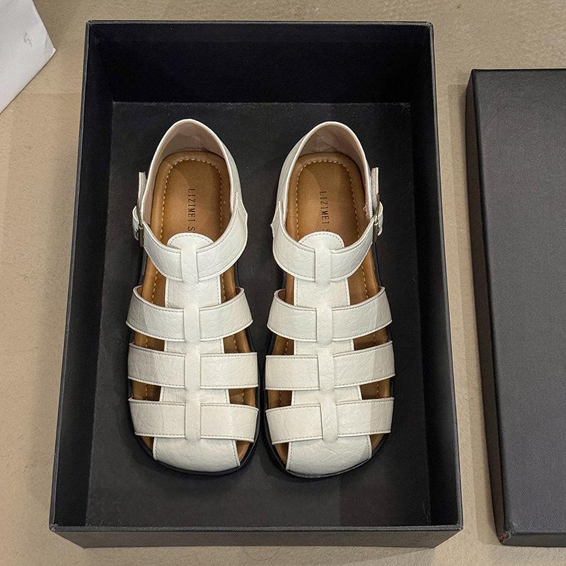 2025 summer new bag head hollow soft sole Roman shoe buckle flat bottom woven retro large size beach sandals women