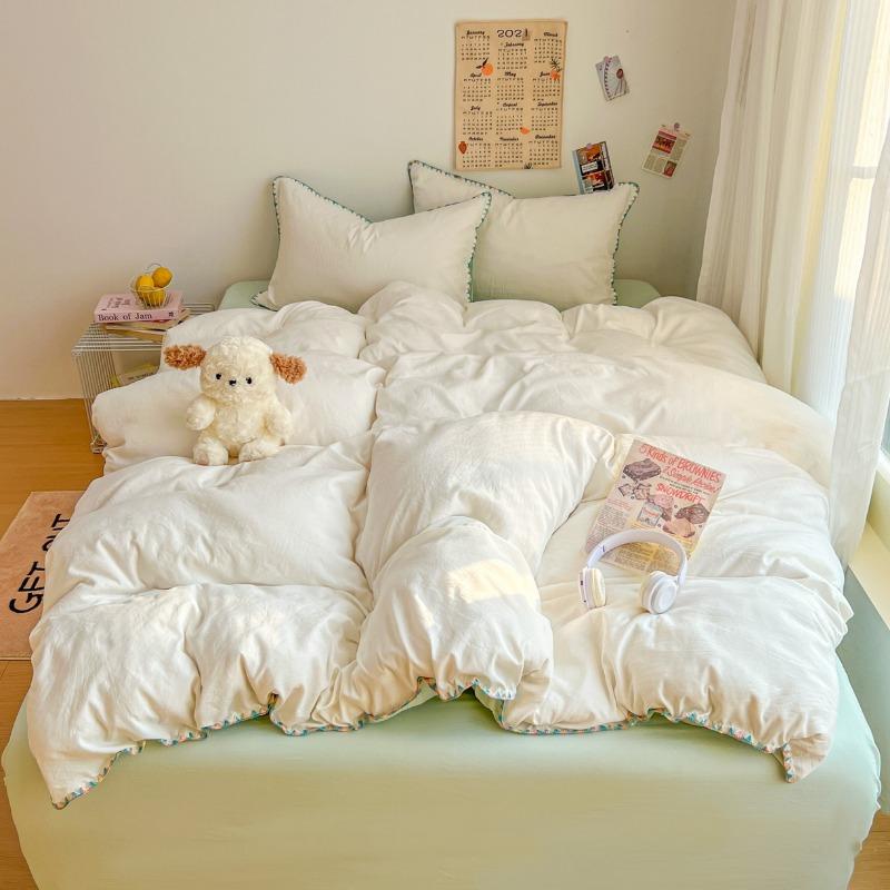 Literie Class A 2025 nouveau vent crème couleur unie drap de lit ensemble quatre pièces housse de couette étudiante ensemble quatre pièces ménage