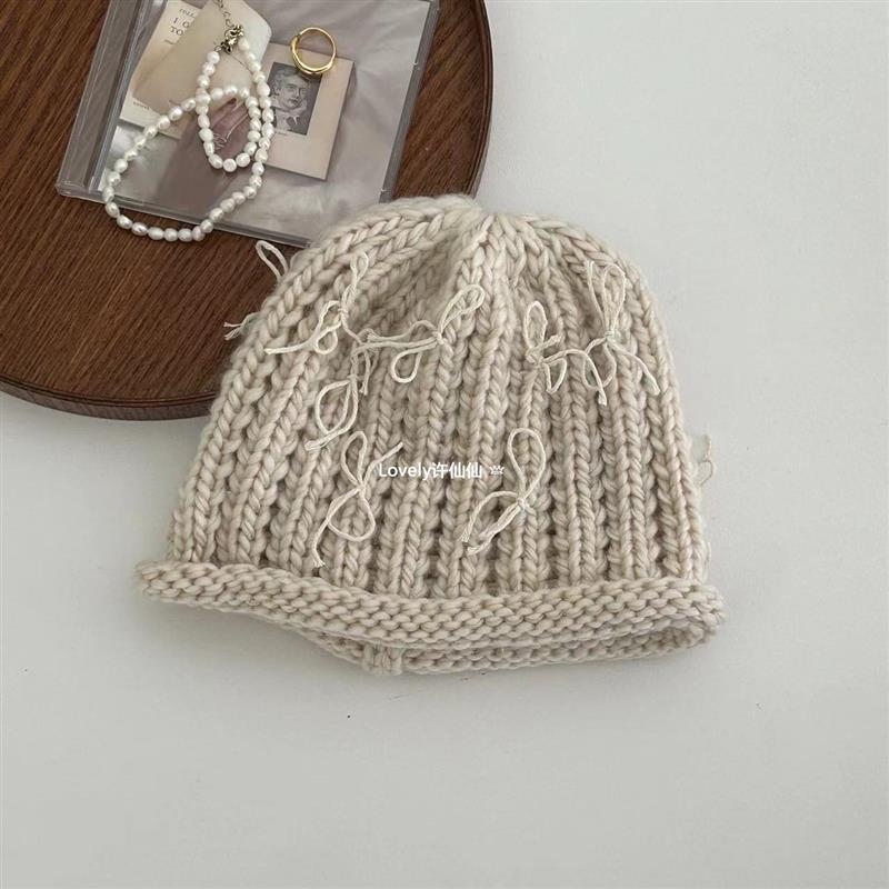 Autumn and winter crimped bow knitted bag head fashionable cold hat women's trendy new wool hat warm and sweet