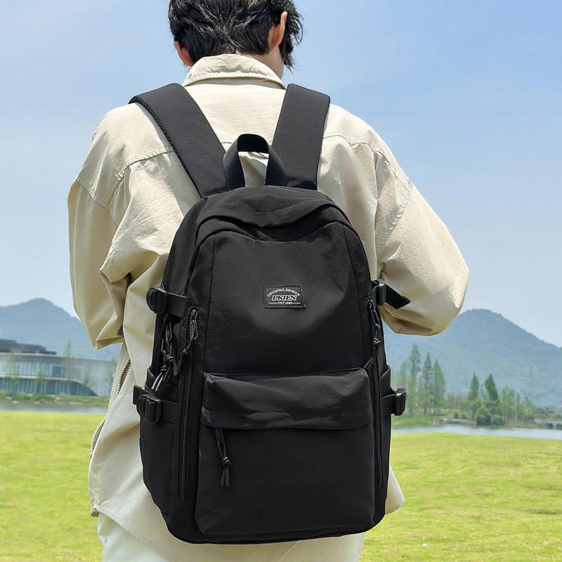 Couple backpack large capacity anti-splashing fashion backpack casual junior high school college student schoolbag high value