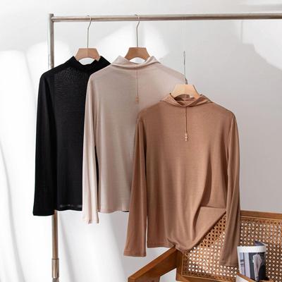 Haut d'automne/hiver pour femme en soie de mûrier à col semi-haut avec détail boutonné