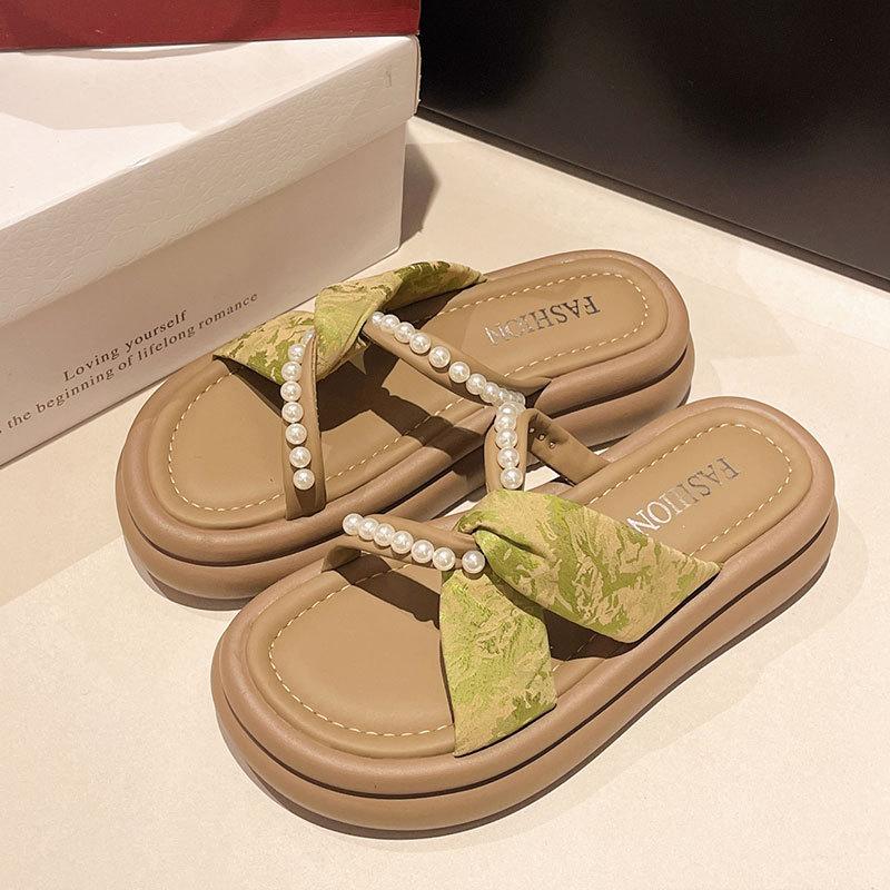 Thick bottom height increase outer wear one-word slippers female 2025 summer new fairy wind French beach pearl cool slippers