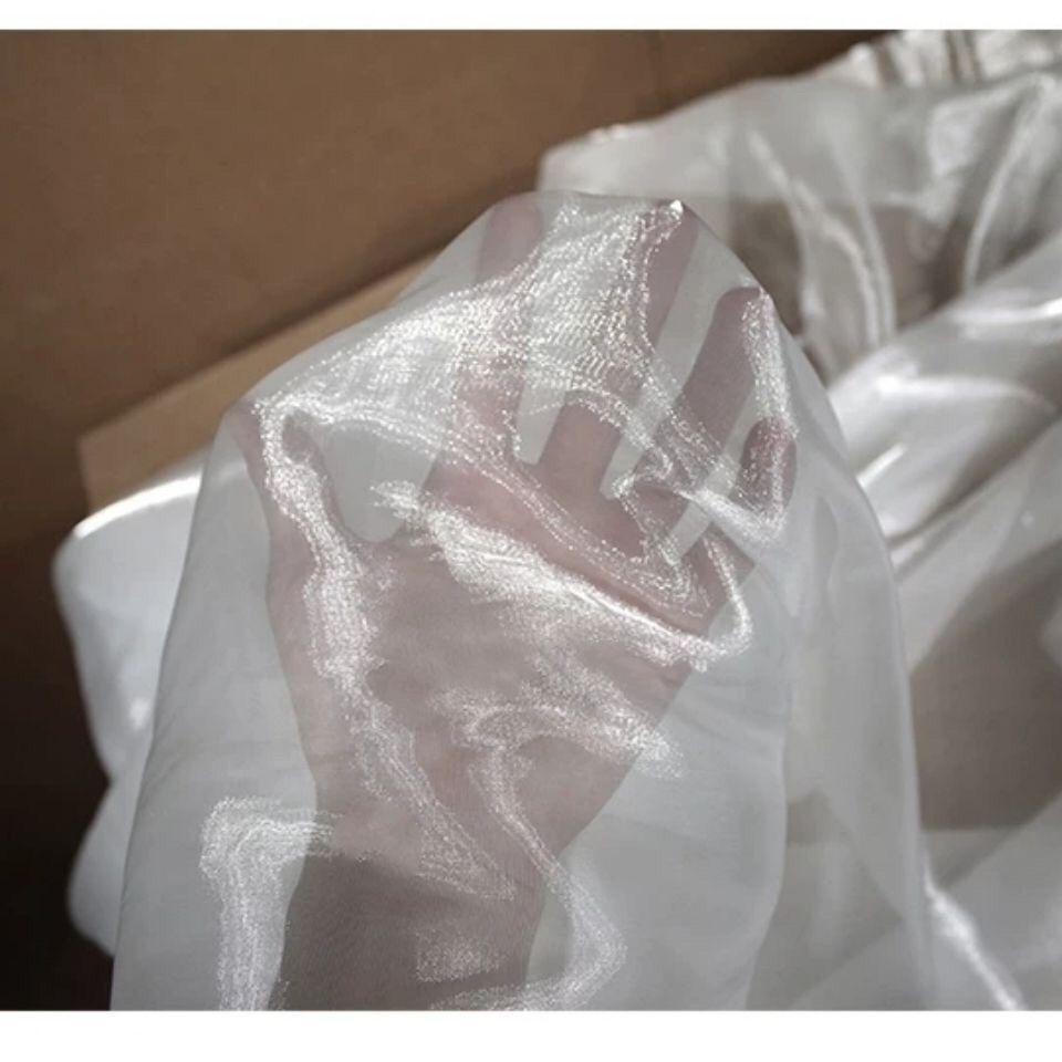 Pearl-like transparent lightweight smooth organza fabric suitable for wedding dresses formal gowns and designer clothing fabrics