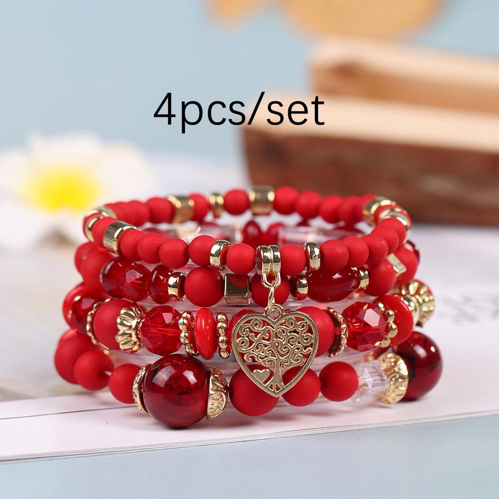 Bohemian Multi-Layer Tassel Bracelet Set with Hollow Heart Pendants and Glass Beads.
