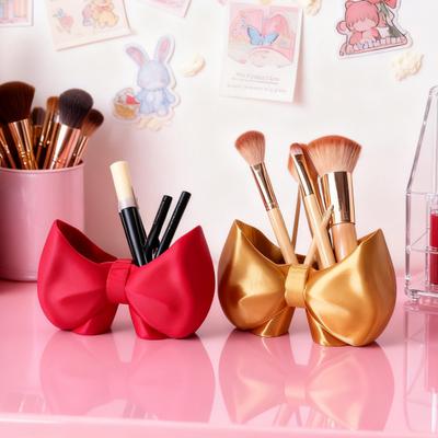 Niedlicher Schleifen-Zahnbürstenhalter Make-up-Pinsel-Organizer Schleifenförmiger Pinselständer Kamm Stiftehalter für Badezimmer Waschtisch Arbeitsplatte