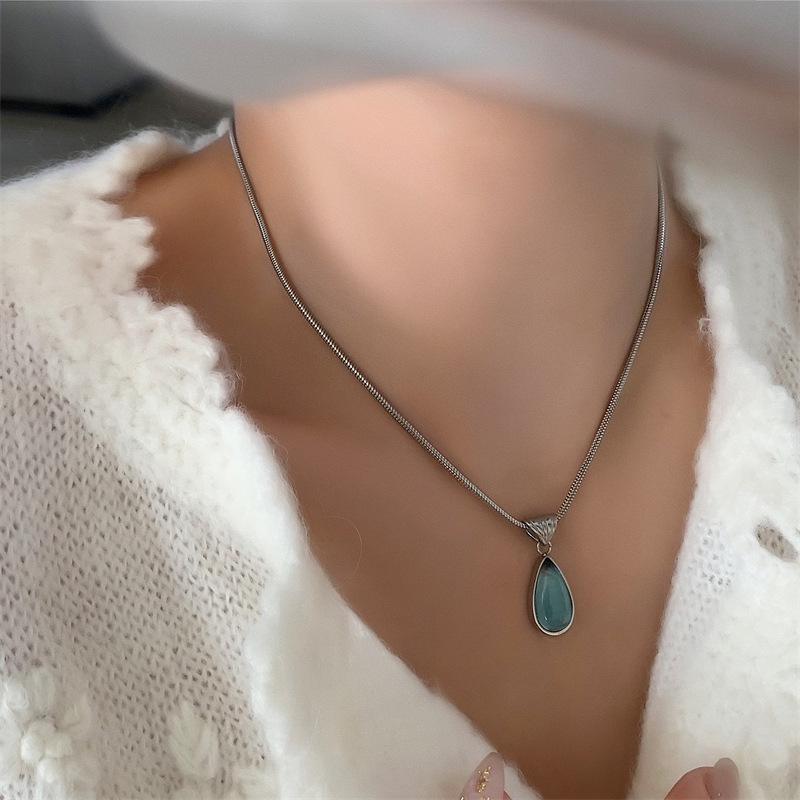 French Transparent Green Water Drop Ocean Necklace with Snake Bone Chain - Fashionable Gold-Plated Titanium Steel.