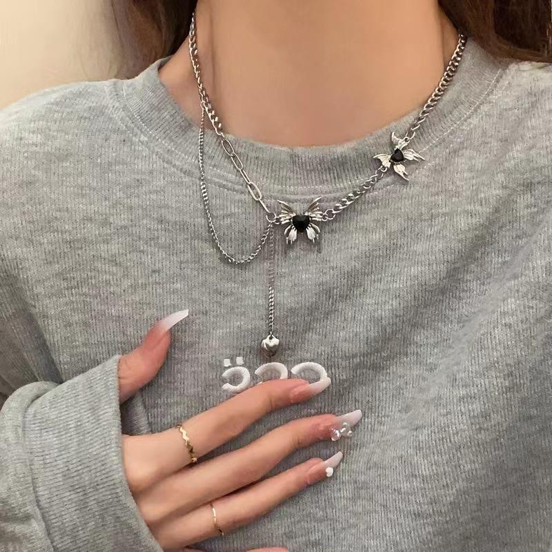 

Liquid butterfly tassel necklace women s new light luxury high-end design sense niche sweater chain tide
