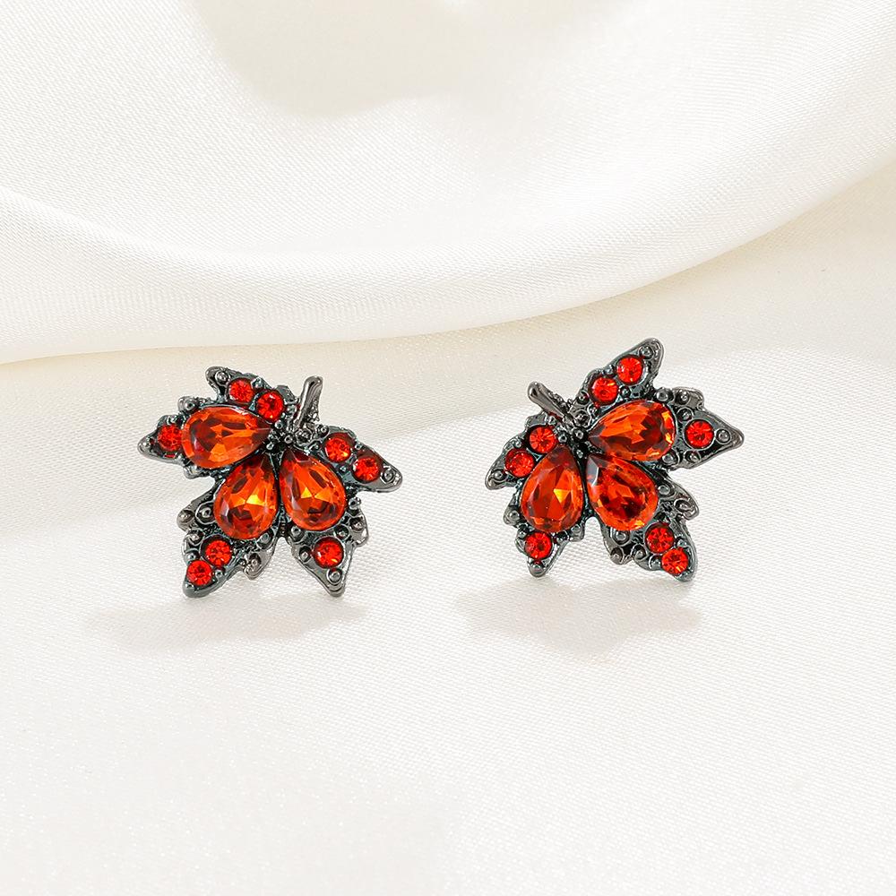 2026 Retro Red Zircon Maple Leaf Stud Earrings – Light Luxury Fashion Jewelry for Women
