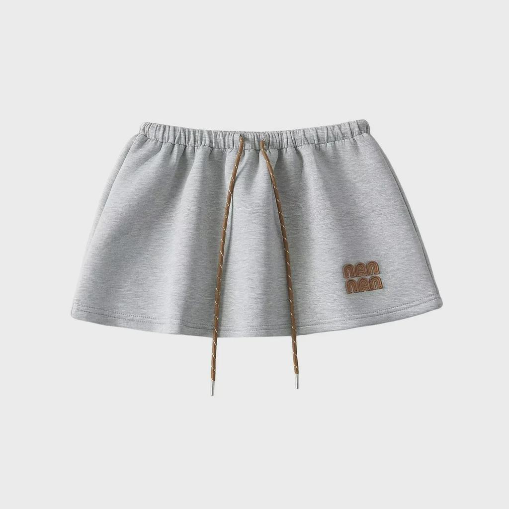 "Sweet Sports Style Mini Skirt: Elastic Waist, Air Layer Embroidery, Anti-Exposure, Versatile Sweater Material for Women."
