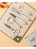 A 6-piece Kitchen Tool Fruit Slicer Set with Storage Holder, Melon Planer, Scissors, Bottle Opener, and Egg Beater Set