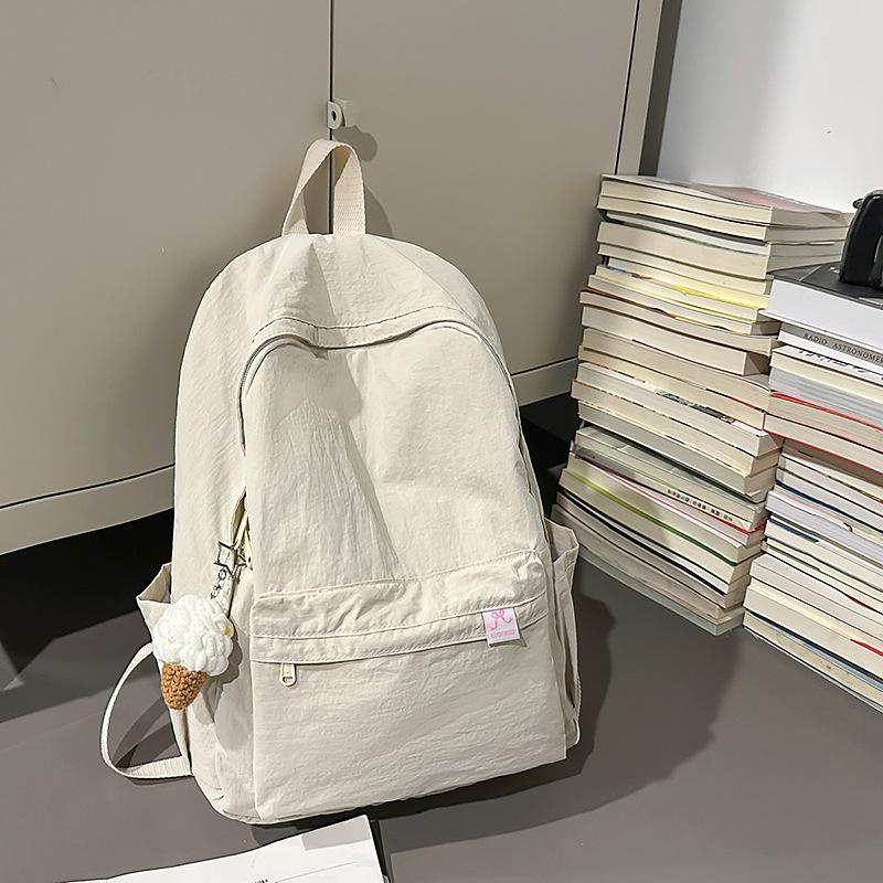 Japanese simple solid color schoolbag female college student casual versatile backpack large capacity junior high school student travel backpack