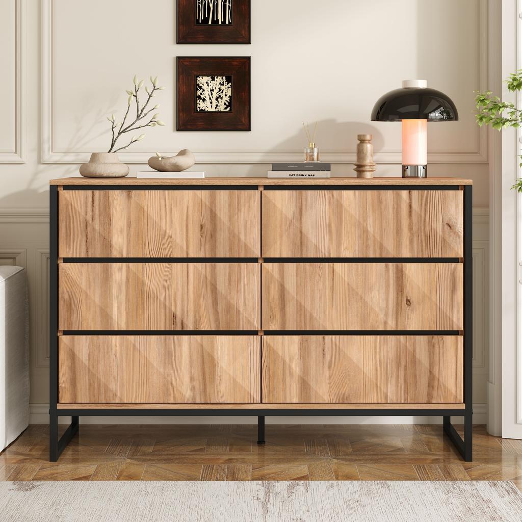 The sideboard and the chest of drawers are characterized by a combination of black and natural wood tones, metal legs and raised doors.